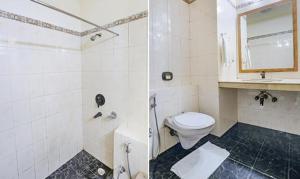 a bathroom with a toilet and a sink at FabHotel Altus in Gurgaon