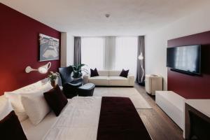 TV a/nebo společenská místnost v ubytování Guesthouse Suiteseven