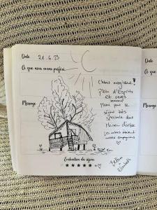 a piece of paper with a drawing of a tree at Nuit insolite - La cabane du Haut-Doubs in Les Gras