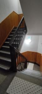 a spiral staircase in a building with a light at Hôtel de France in Limoges