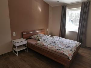 Postel nebo postele na pokoji v ubytování Ferienwohnung Gestüt von Erden