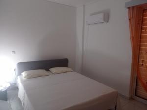 Postel nebo postele na pokoji v ubytování Pireas view