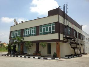 a building with a staircase on the side of it at Hotel Checkedinn in Ipoh