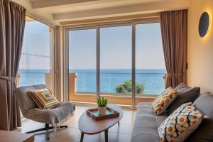 a living room with a view of the ocean at Creta Spirit in Plakias