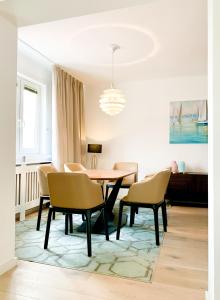 a dining room with a table and chairs at Luxury suburb house - bright, quiet, beautiful in Vienna