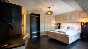 Letto o letti in una camera di Hotel Old Dutch
