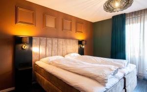 Letto o letti in una camera di Hotel Old Dutch