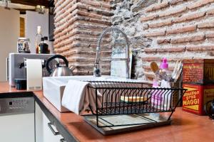 a kitchen counter with a sink in a kitchen at Loft charmant dans le centre historique in Nantes