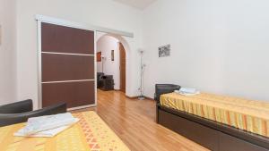 A bed or beds in a room at Rental in Rome Santini apartment