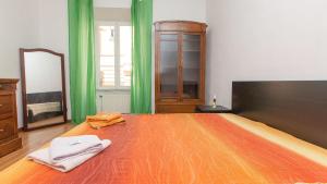 A bed or beds in a room at Rental in Rome Santini apartment