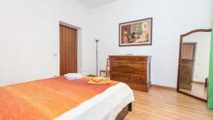 A bed or beds in a room at Rental in Rome Santini apartment