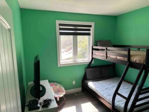 a room with two bunk beds and a window at Headlands Airbnb in Rockport