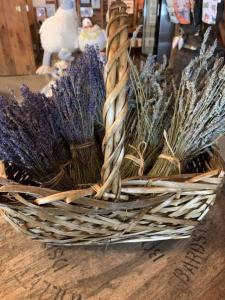 a basket of lavender sitting on a wooden floor at Luxury Farm Stay-Glenrose Cottage-Wolf Pine Hollow in Hancock