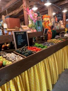 a display of fruits and vegetables in a store at Luxury Farm Stay-Glenrose Cottage-Wolf Pine Hollow in Hancock