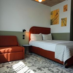 Postel nebo postele na pokoji v ubytování Arche Hotel Wrocław Airport