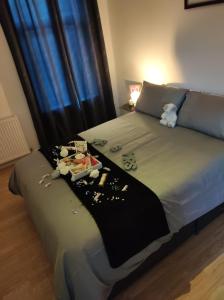 a bed with a tray of items on it at Entire home for 5-6 guests in Horwich in Horwich
