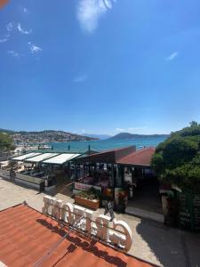 a group of benches sitting on top of a roof at Apartments Grifone Lux in Herceg-Novi