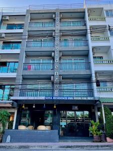 a building with a sign that reads tour residence inn honolulu at Sota Residence in Pattaya South