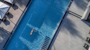 an overhead view of a person in a swimming pool at Steigenberger Hotel Der Sonnenhof in Bad Wörishofen