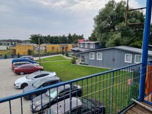 a group of cars parked in a parking lot at Pylimo 59 in Šventoji