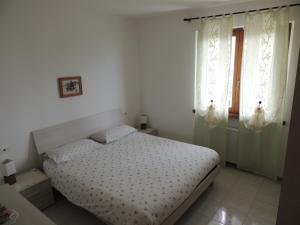 Ένα ή περισσότερα κρεβάτια σε δωμάτιο στο Beggiato
