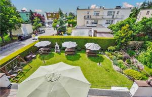 an overhead view of a garden with umbrellas at Nice Home In Kolobrzeg With Wifi in Kołobrzeg