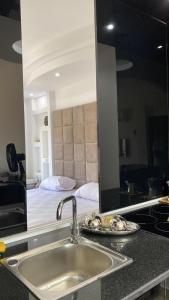 a kitchen counter with a sink and a mirror at Designer Apartment in Sunny Lakes 2 Sharm El Sheikh komplett renoviert auch für Langzeitmieter buchbar in Sharm El Sheikh