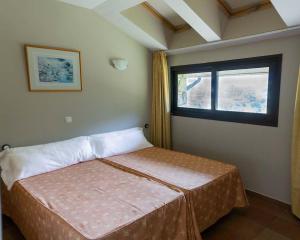 Кровать или кровати в номере Hotel Ransol