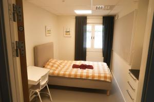 Säng eller sängar i ett rum på Skrå hostel - bed & business