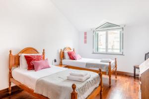 Postel nebo postele na pokoji v ubytování A ver o mar rooms- Funchal city center