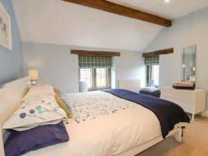 Säng eller sängar i ett rum på Fern Cottage
