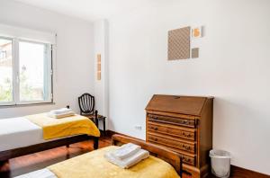 Postel nebo postele na pokoji v ubytování A ver o mar rooms- Funchal city center
