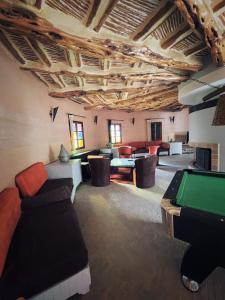 a living room with a pool table in a room at CHATEAU D'ORIENT in Essaouira