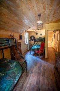 a bedroom with two bunk beds in a cabin at Chalet : le moulin du sagard in Wisches +124 photos