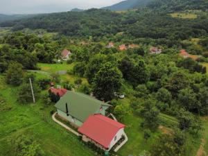 an aerial view of a house with a red roof at Wooden house in Hondol