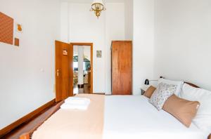 Postel nebo postele na pokoji v ubytování A ver o mar rooms- Funchal city center