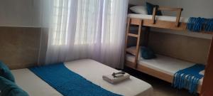 Postel nebo postele na pokoji v ubytování posada barrios mar