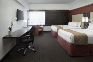 Ліжко або ліжка в номері Hotel Ruby Foo's