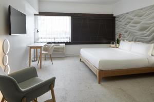 Ліжко або ліжка в номері Hotel Ruby Foo's
