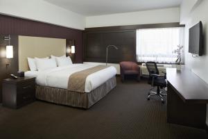 Ліжко або ліжка в номері Hotel Ruby Foo's