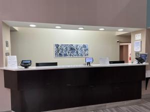 a lobby with a large black and white counter at Sleep Inn Northlake in Charlotte +30 photos