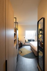 Postelja oz. postelje v sobi nastanitve Ariane Hotel
