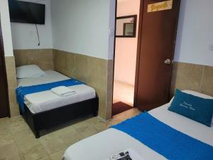 Postel nebo postele na pokoji v ubytování posada barrios mar