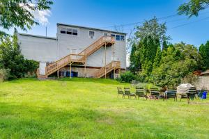 a house with a deck and chairs in the yard at Cozy Scranton Studio Rental Pets Welcome! in Scranton