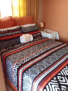 Кровать или кровати в номере Stonebass Lodge