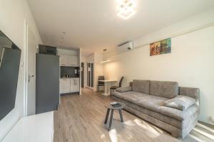 a living room with a couch and a table at AR Rezidencia Fibichova in Košice