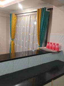 a kitchen with a black counter top and a window at Executive 3 bedroom in Nakuru CBD in Nakuru