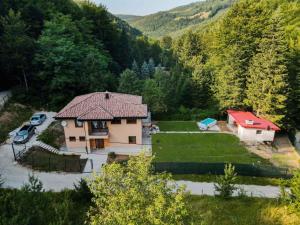 an aerial view of a house in the mountains at Villa Rivus in Sarajevo