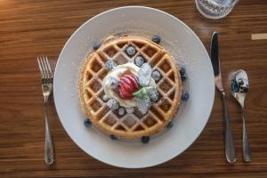 a plate with a waffle with fruit and ice cream at JW Marriott Clearwater Beach Resort & Spa in Clearwater Beach