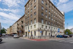 a large building on the corner of a street at Stylish Apartment Warsaw Downtown by Renters in Warsaw